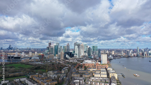 Aerial bird s eye panoramic photo taken by drone of iconic Canary Wharf skyscraper complex and business district  Isle of Dogs  London  United Kingdom