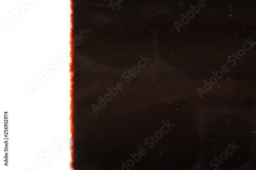 Background. The illuminated film. Abstraction. Noise.Negative films 35mm. Scan of personal 35mm films