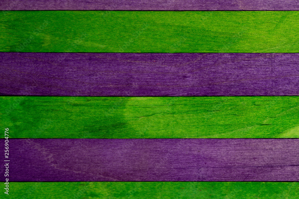 Beautiful texture of natural wood slats of green and purple colors. Natural and aged appearance. Beautiful texture of natural wood slats of green and purple colors. Natural and aged appearance.