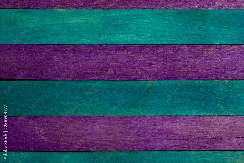 Beautiful texture of natural wood slats in purple and blue colors (turquoise). Natural and aged appearance. Beautiful texture of natural wood slats in purple and blue colors (turquoise). Natural and aged appearance.