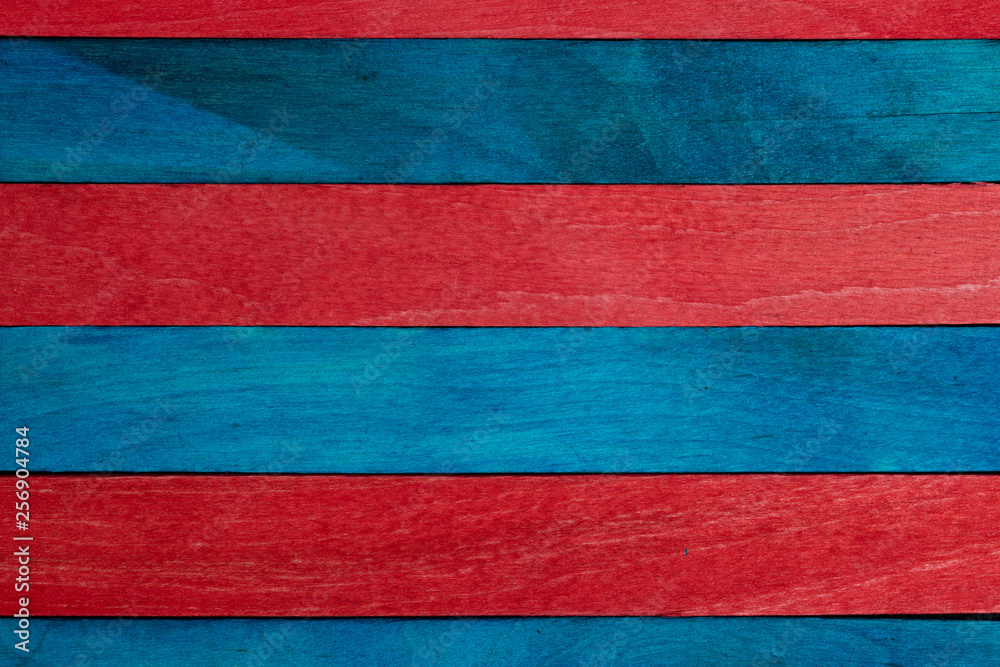 Beautiful texture of natural wood slats of blue (turquoise) and red colors. Natural and aged appearance. Beautiful texture of natural wood slats of blue (turquoise) and red colors. Natural and aged appearance.