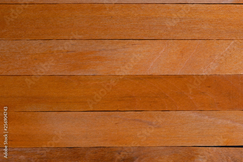 Beautiful texture of natural orange wood slats. Horizontal sense