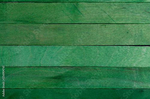 Beautiful texture of natural green wood slats. Vertical sense