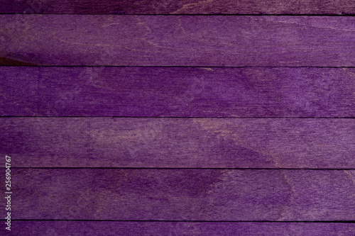 Beautiful texture of natural wood slats purple. Vertical direction