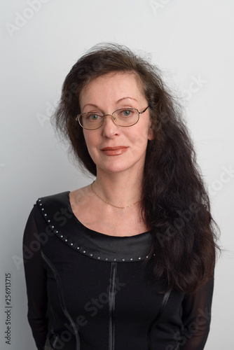 Wallpaper Mural Beautiful adult woman with glasses on white background in photo Studio. Torontodigital.ca