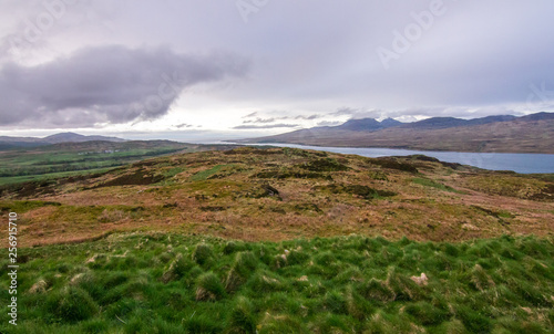 Fotografie, Tablou View of upland fields, barren landscapes, the ocean, and hills on the island of Jura, as seen from the Island of Islay, Scotland