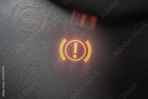 Handbrake warning light sign illuminated close up