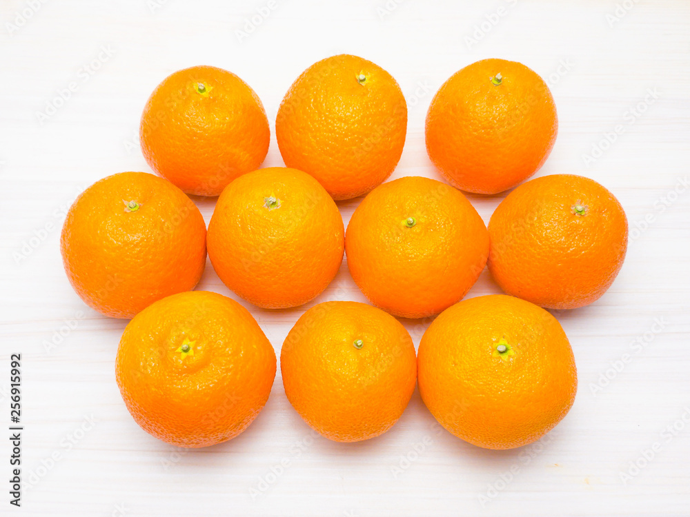 Ripe tangerines (mandarins) on a white wooden background Ripe tangerines (mandarins) on a white wooden background