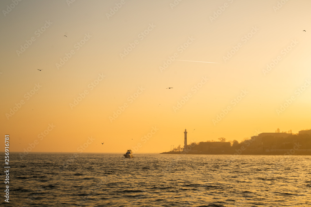Sunset on sea coast with buildings. Sunset on sea coast with buildings.