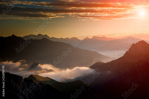 Fototapeta Naklejka Na Ścianę i Meble -  Dawn in the mountains with fog