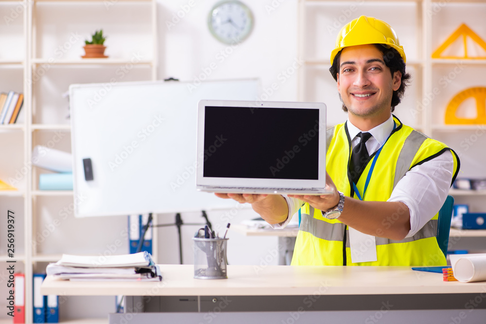 Male construction engineer working in the office Male construction engineer working in the office