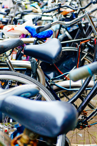 Wallpaper Mural Group of bicycles parking. Sport concept with bicycle. Pile of bikes in the street of netherlands city Amsterdam. Selective focus Torontodigital.ca