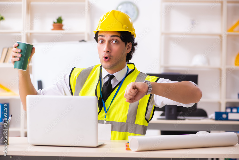 Male construction engineer working in the office Male construction engineer working in the office