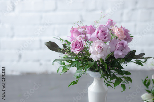 Bouquet of lilac roses and other flowers
