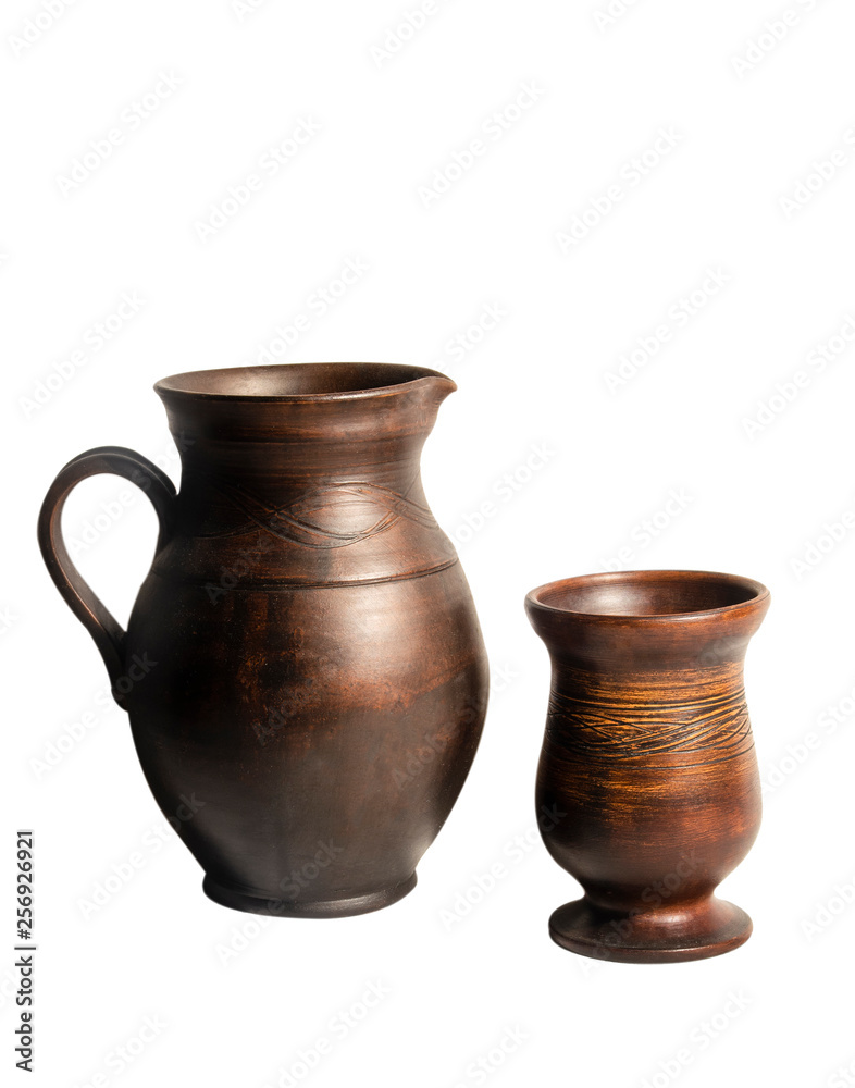 Pottery for drinks on white background..Brown pitcher with handle and bowl. Isolated objects.