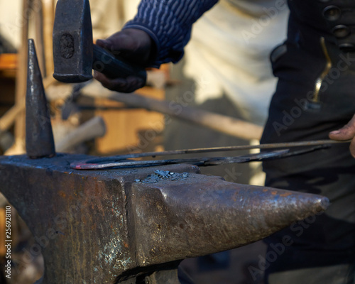 blacksmith working on anvil