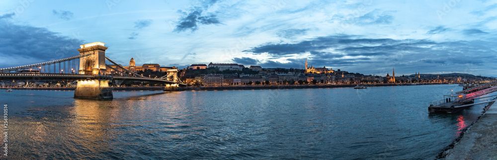 Panoramic sunset view of the Buda shore with Buda Castle, Chain Bridge and Fishermen's Bastion, Budapest, Hungary