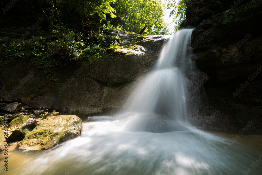 A valley with a waterfall . Russian nature near Sochi, Caucasus Mountains. A valley with a waterfall . Russian nature near Sochi, Caucasus Mountains.