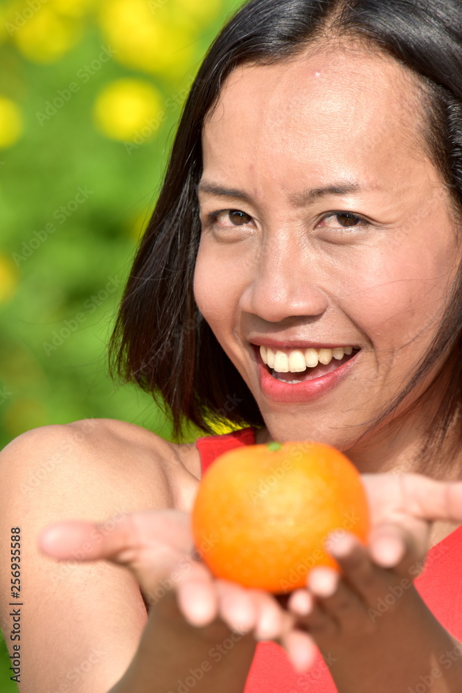 Youthful Diverse Female Smiling With Fruit Youthful Diverse Female Smiling With Fruit