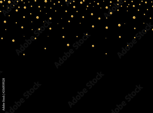 Gold glitter texture isolated on black background. Golden explosion of confetti. Holiday background. 