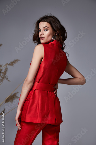Portrait pretty fashion beauty model curly dark hair style beautiful sexy woman perfect skinny body cosmetic makeup mascara blush face skin care wear clothes accessory jewelry earrings herb.