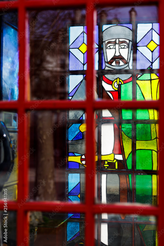 LONDON, UK - MARCH 11 : Traditional Red telephone box with stained glass windows on Victoria Embankment in London on March 11, 2019 LONDON, UK - MARCH 11 : Traditional Red telephone box with stained glass windows on Victoria Embankment in London on March 11, 2019