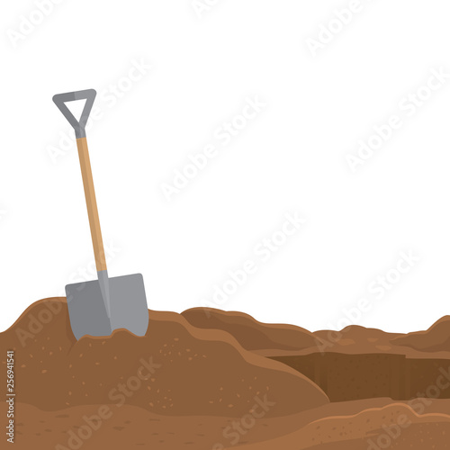 Shovel stuck in the soil isolated