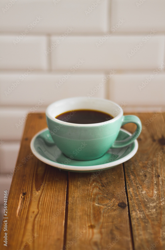 Black coffee in blue cup on wooden background, filter coffee. Black coffee in blue cup on wooden background, filter coffee.