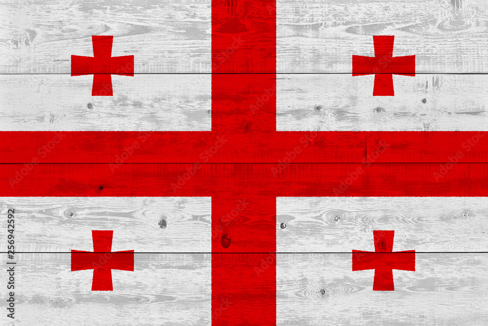 Georgia flag painted on old wood plank Georgia flag painted on old wood plank