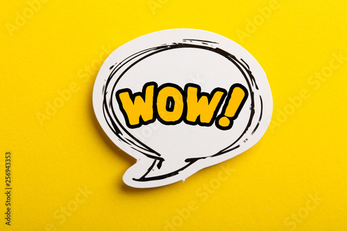 WOW Speech Bubble Isolated On Yellow Background photo