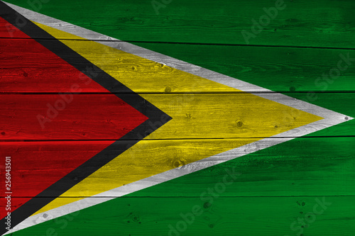 Guyana flag painted on old wood plank