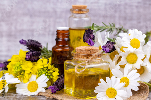 Fototapeta Naklejka Na Ścianę i Meble -  Mixed herbal oil. Essential oil various. Colorful flowers.
