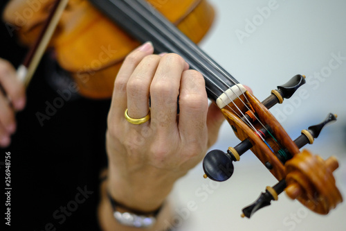 Violinist is practicing. 