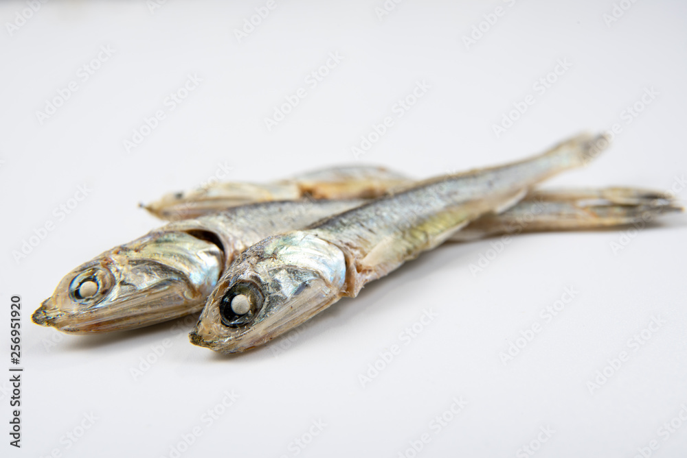 Dried anchovies used in Korean cuisine. Isolated on white background. Dried anchovies used in Korean cuisine. Isolated on white background.