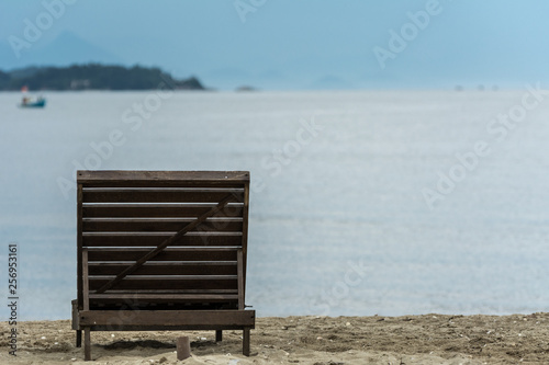Fototapeta Naklejka Na Ścianę i Meble -  One beach chair in front of the sea.