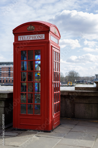 LONDON  UK - MARCH 11   Traditional Red telephone box with stained glass windows on Victoria Embankment  in London on March 11  2019