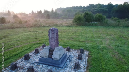 4K video of Drone flight above monument (1813 year built) near the Spaso-Borodinsky monastery in Shevardino village from the birds sight photo