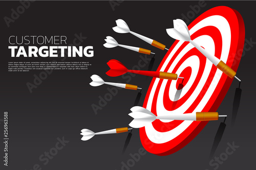 one of dart arrow hit the center of dartboard . Business Concept of missing the marketing target and customer.success on company mission and goal.