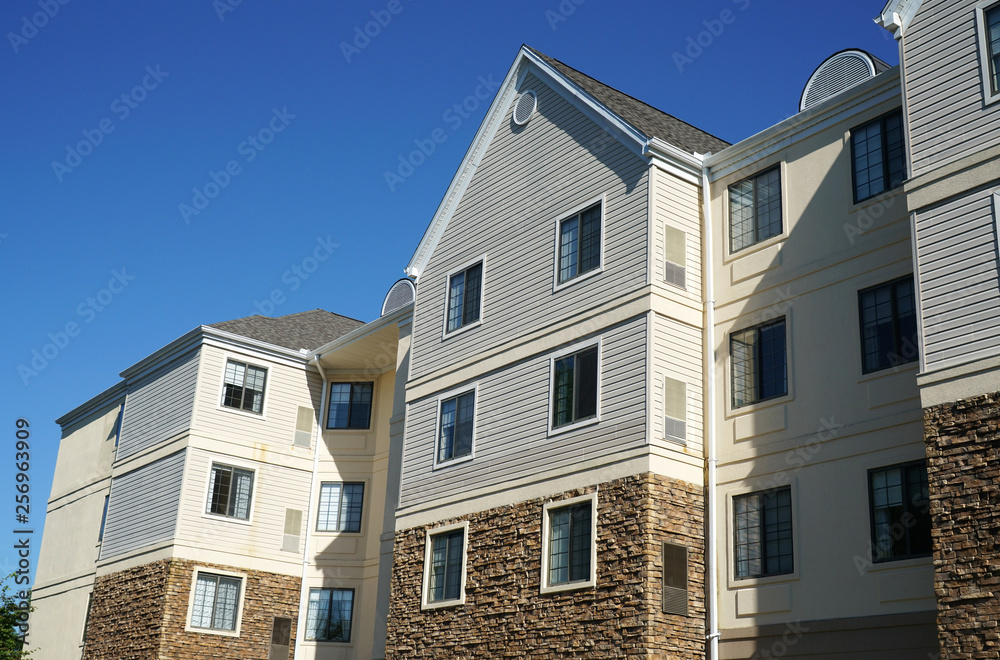 modern rental apartment buildings in sunny day