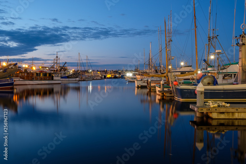 Long exposure of boats at a harbor at nighttime