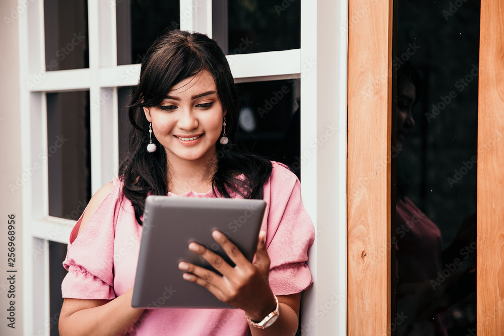 asian business woman using tablet pc. young entrepreneur with her startup company asian business woman using tablet pc. young entrepreneur with her startup company