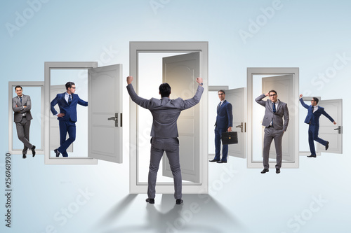 Businessman in uncertainty concept with many doors