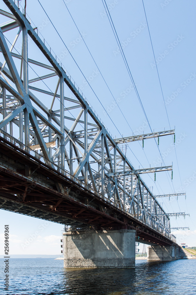 High metal bridge on concrete supports.