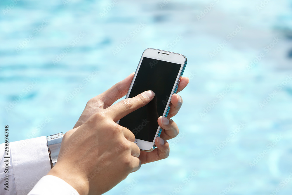 unrecognizable businessman using phone