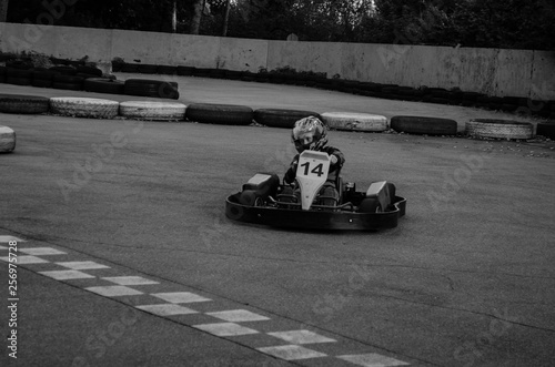 On the racetrack the child is approaching the finish line © karen