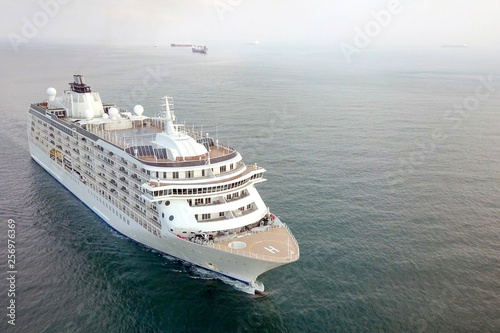 Large cruise ship at sea - Aerial image at sunrise.