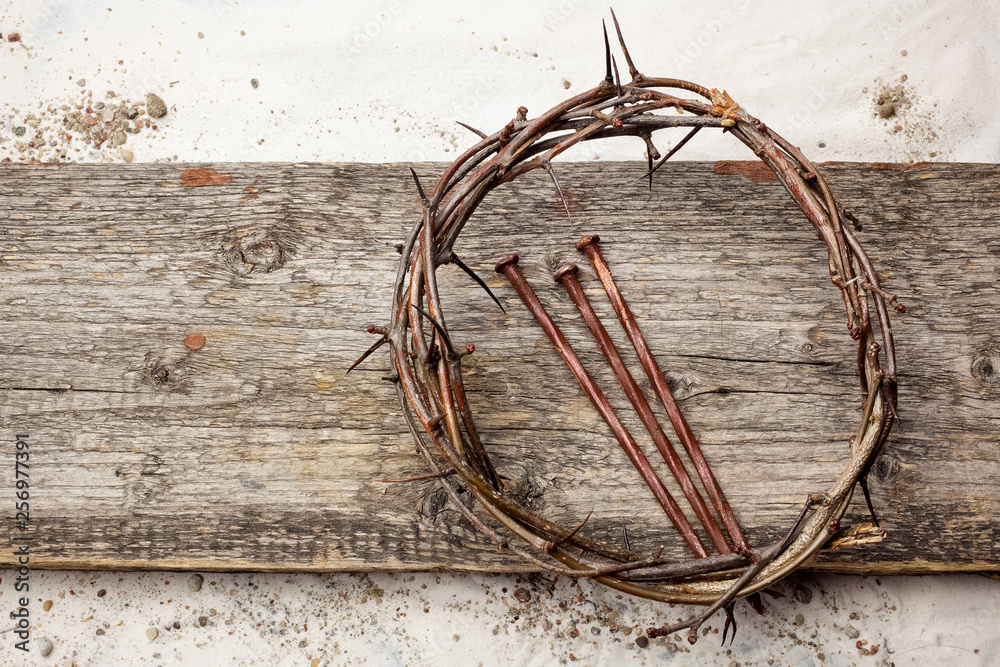 Jesus Crown Thorns and nails on Old and Grunge Wood Background. Vintage Retro Style.