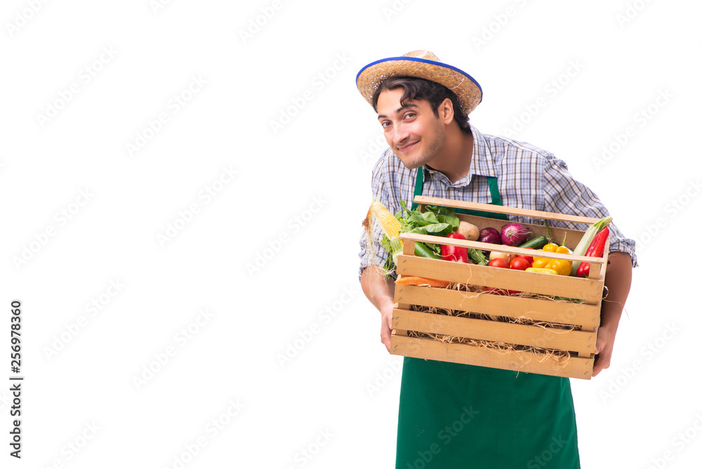 Young farmer with fresh produce isolated on white background