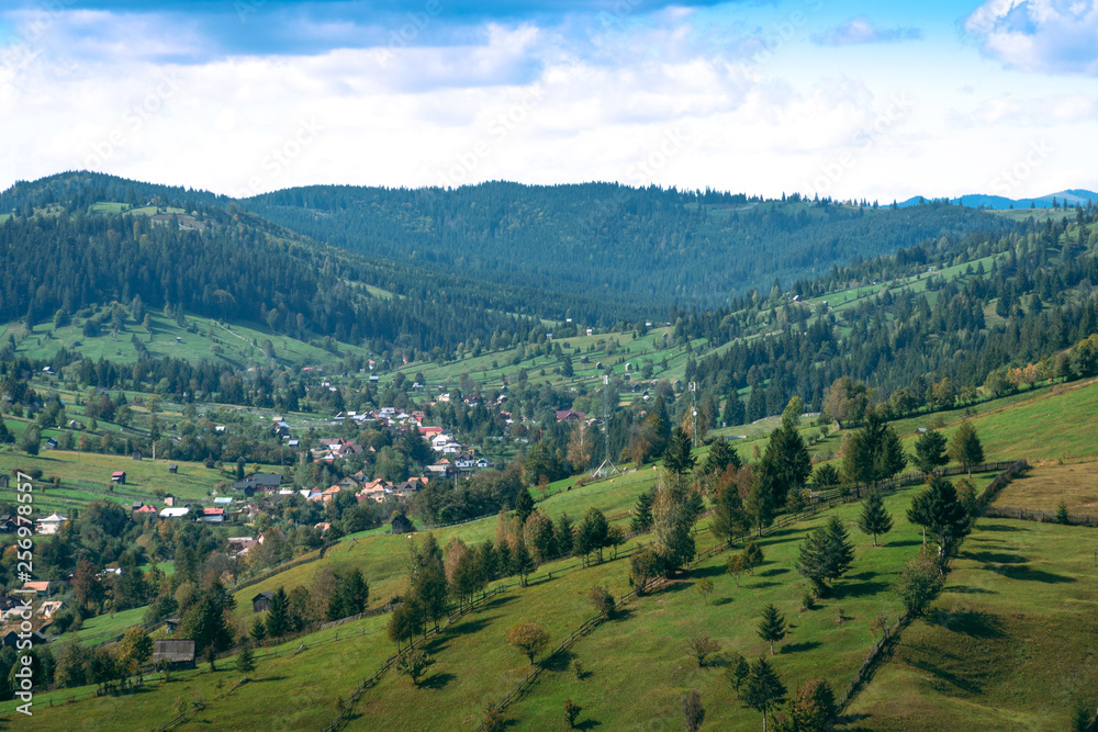 Fototapeta premium Beautiful view of traditional mountain small city on scenic Romania, autumn day