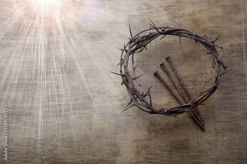 Jesus Crown Thorns and nails on Old and Grunge Wood Background. Vintage Retro Style. Free space for text